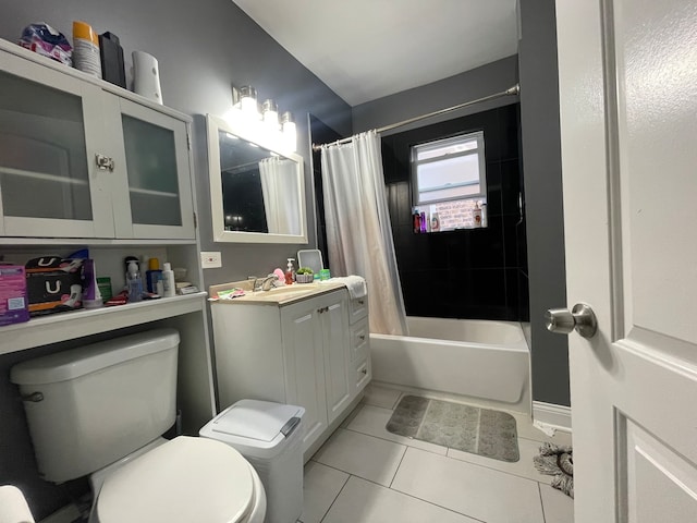 full bathroom with toilet, tile patterned flooring, vanity, and shower / tub combo