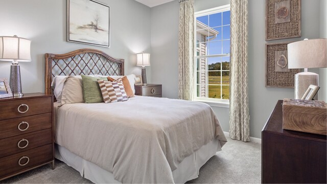 bedroom featuring light colored carpet