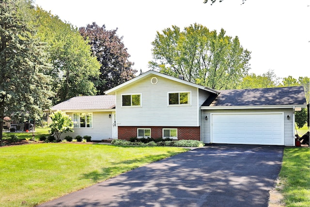 tri-level home with a front lawn and a garage