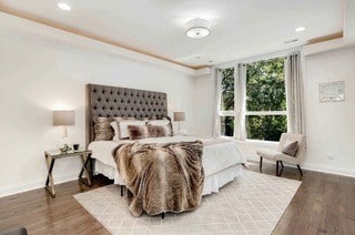 bedroom with hardwood / wood-style flooring