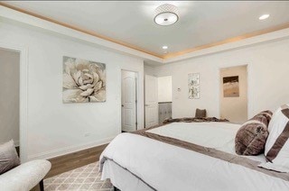 bedroom featuring hardwood / wood-style floors