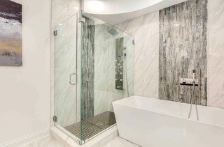 bathroom with shower with separate bathtub