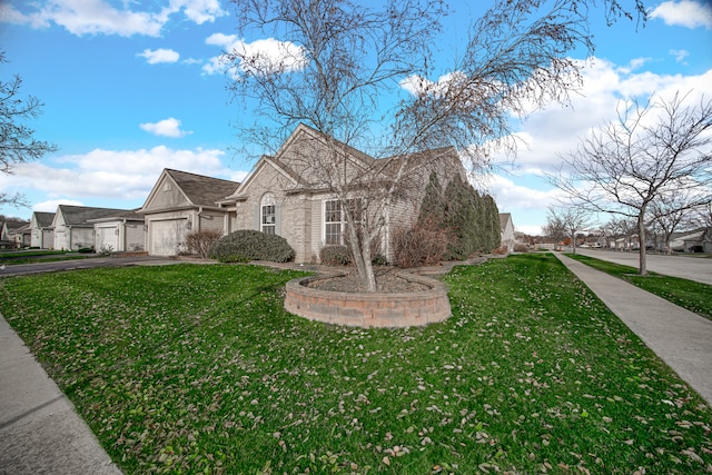 view of front of house featuring a front yard and a garage