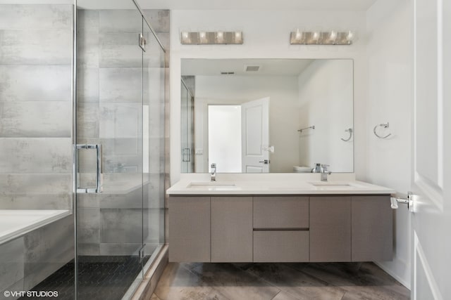 bathroom featuring plus walk in shower and vanity