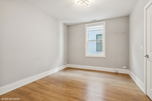 unfurnished room featuring light hardwood / wood-style flooring