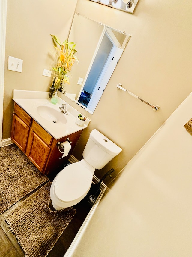 bathroom with vanity and toilet