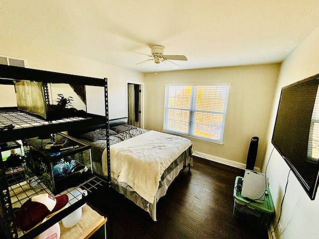 bedroom with dark wood-type flooring and ceiling fan