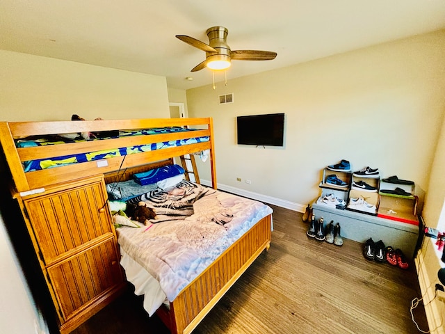 bedroom with ceiling fan and hardwood / wood-style floors