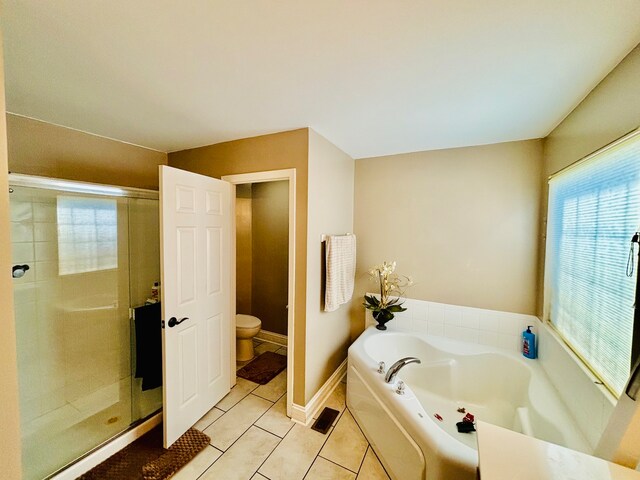 bathroom featuring separate shower and tub, toilet, and tile patterned flooring