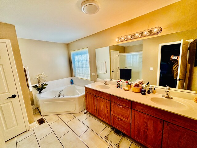 bathroom featuring vanity, independent shower and bath, and tile patterned floors