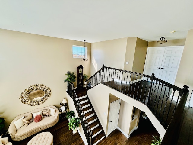 stairs with hardwood / wood-style floors