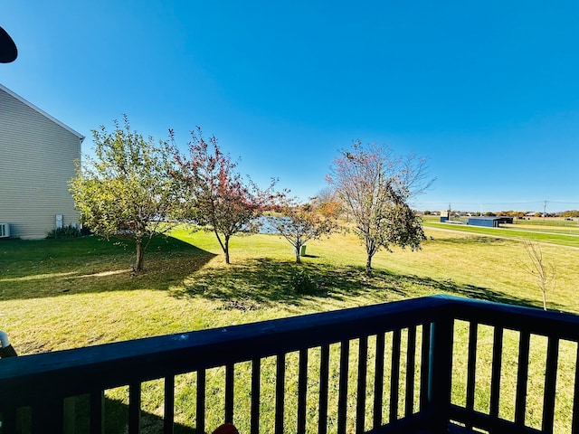 view of yard with a balcony