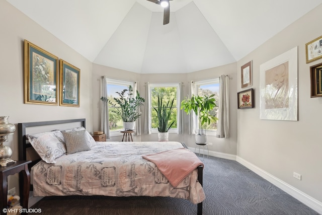 bedroom featuring dark colored carpet, ceiling fan, and vaulted ceiling