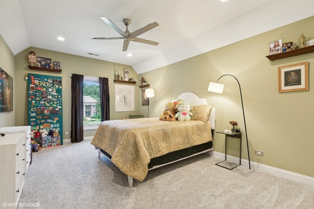 carpeted bedroom with vaulted ceiling and ceiling fan