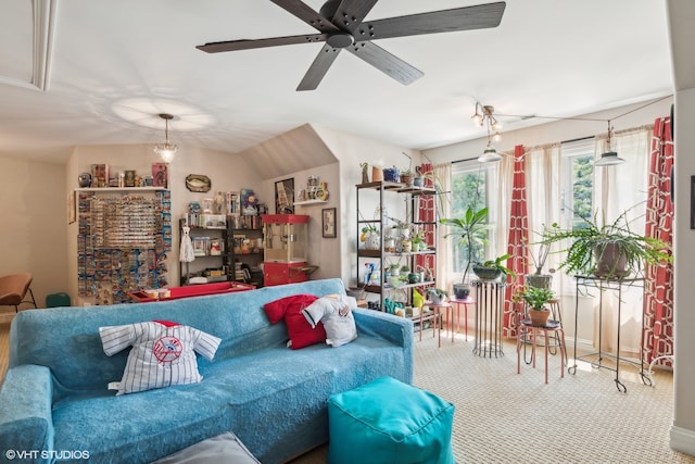 carpeted living room featuring ceiling fan