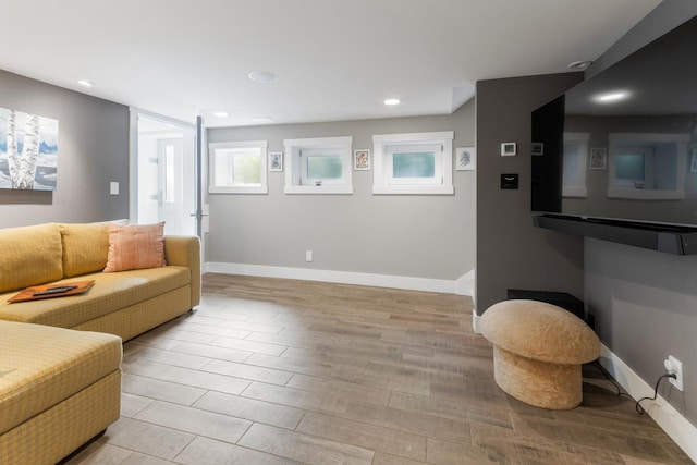 living room with light hardwood / wood-style flooring