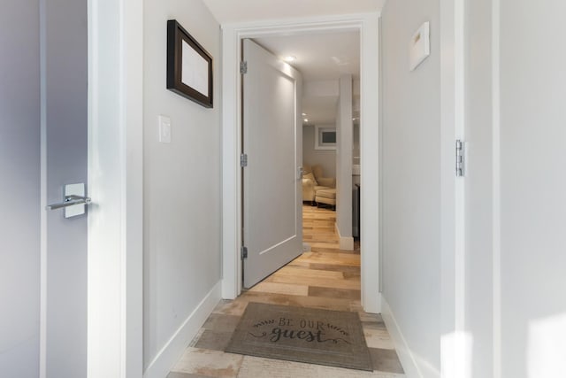 hall with light hardwood / wood-style flooring