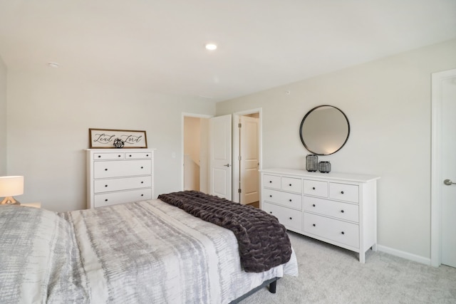 bedroom featuring light carpet