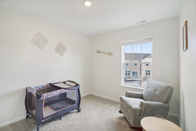 sitting room with carpet flooring