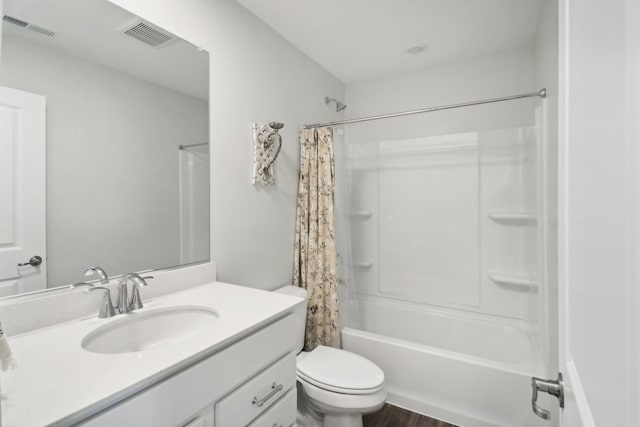 full bathroom featuring vanity, shower / bath combination with curtain, wood-type flooring, and toilet