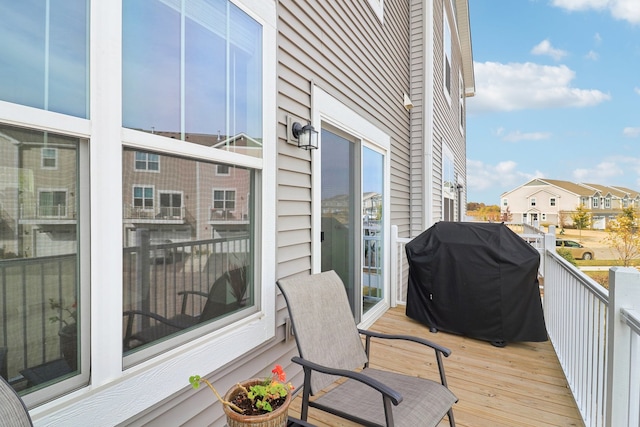 wooden deck featuring area for grilling