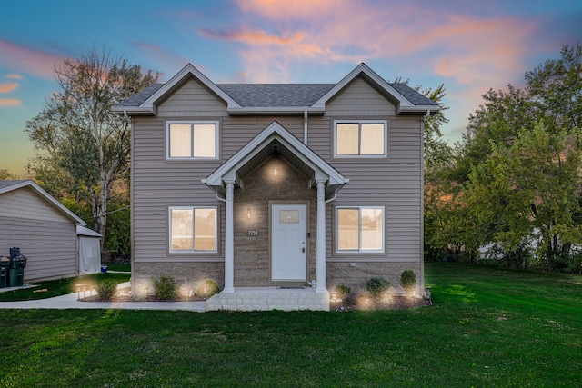 view of front of property with a lawn