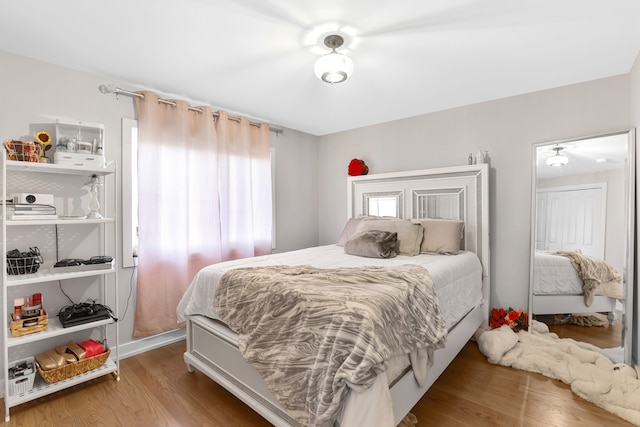 bedroom with hardwood / wood-style flooring