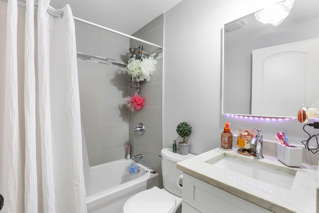 full bathroom featuring shower / bath combination with curtain, vanity, and toilet