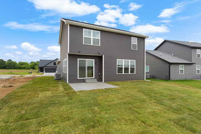 rear view of property featuring cooling unit, a patio area, and a yard