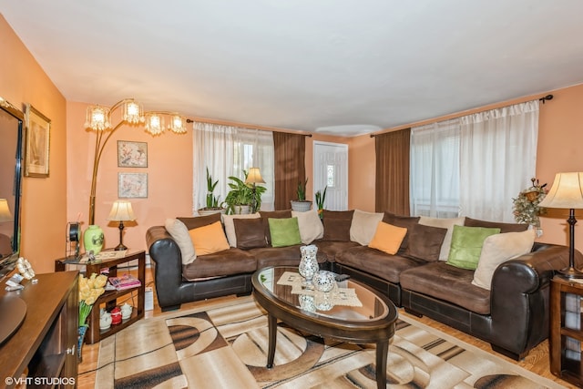 living room featuring a notable chandelier