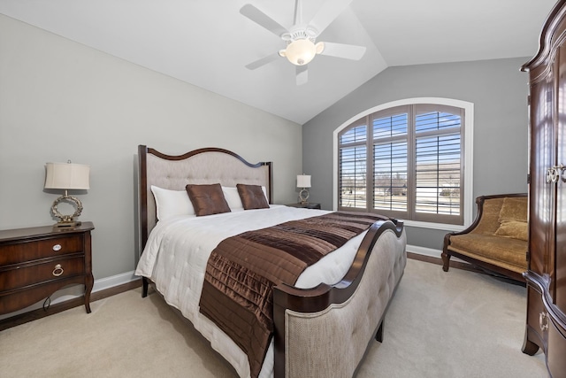 bedroom with vaulted ceiling, light colored carpet, and ceiling fan