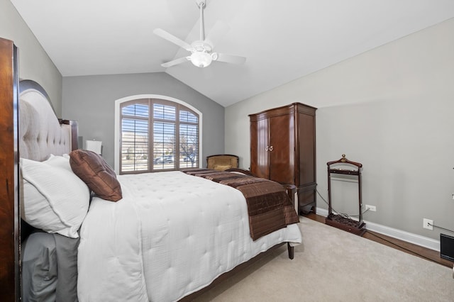 bedroom featuring hardwood / wood-style floors, vaulted ceiling, and ceiling fan