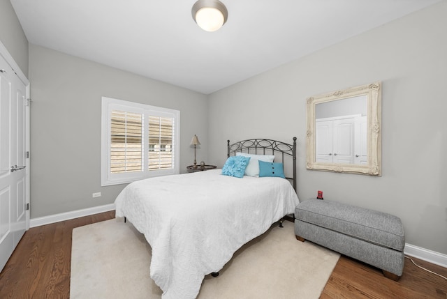 bedroom with wood-type flooring