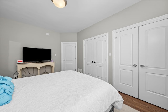 bedroom featuring dark wood-type flooring