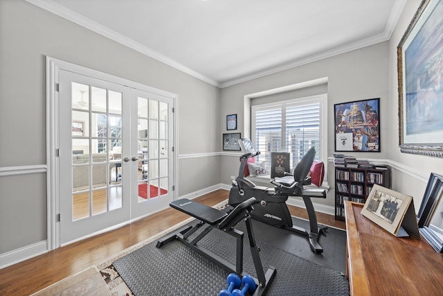 exercise room featuring hardwood / wood-style flooring, crown molding, and french doors