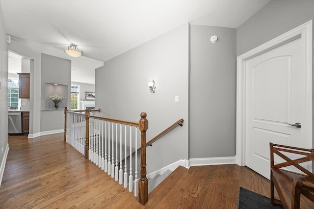 hall with hardwood / wood-style floors