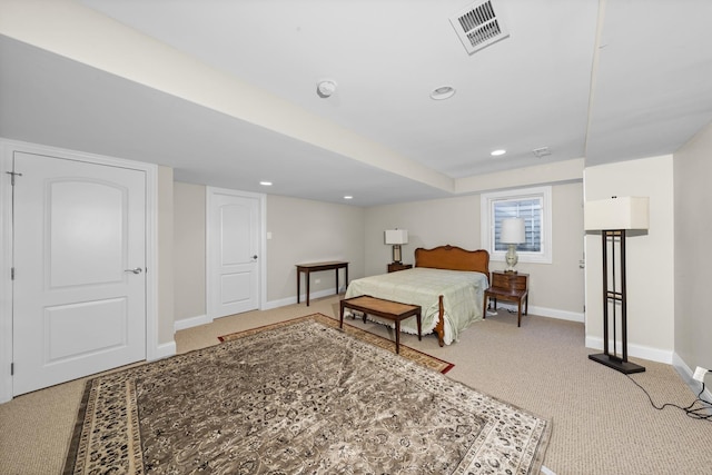 bedroom featuring light colored carpet