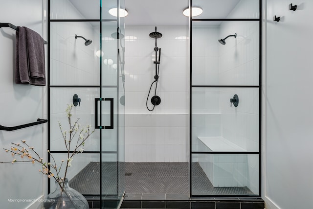 bathroom with a shower with door