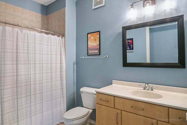 bathroom with vanity, toilet, and a shower with curtain