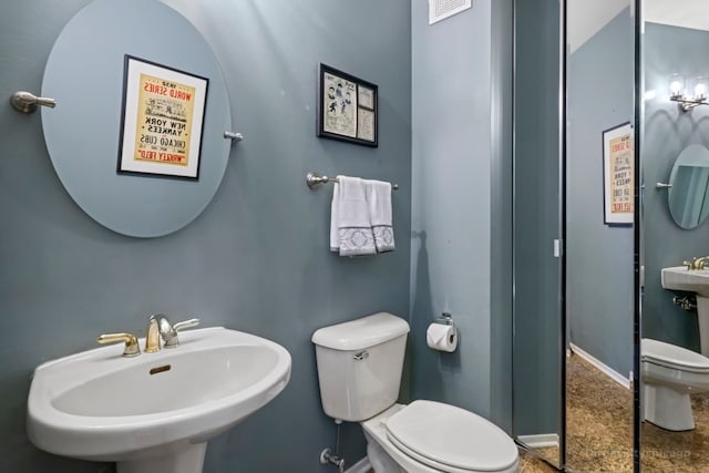 bathroom with sink and toilet