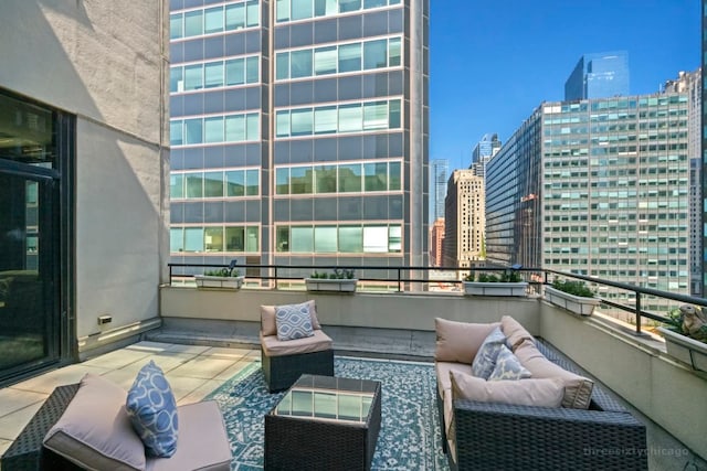 view of patio featuring a balcony