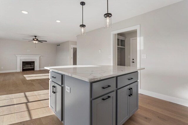 mudroom with light wood-type flooring and ceiling fan