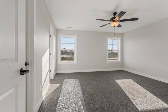 carpeted empty room featuring a textured ceiling