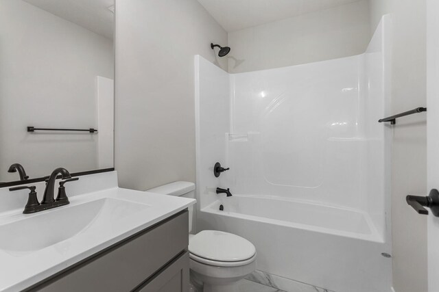 full bathroom featuring vanity, toilet, and shower / bath combination