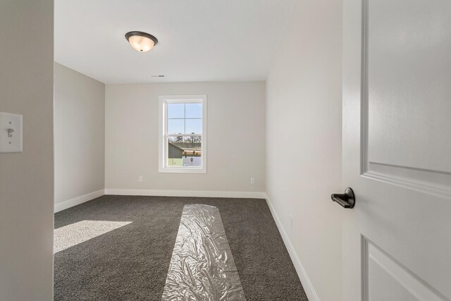 spare room with light colored carpet, ceiling fan, and a healthy amount of sunlight