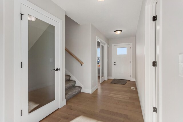 corridor featuring light hardwood / wood-style floors