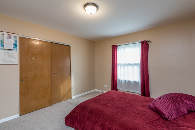 carpeted bedroom with a closet