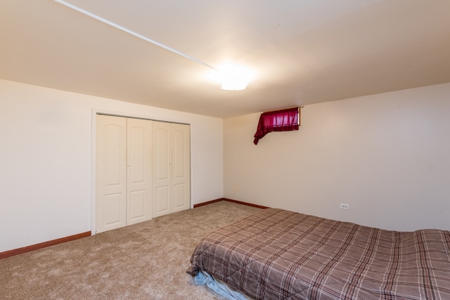 unfurnished bedroom featuring a closet and carpet floors