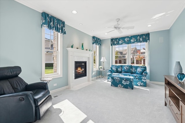 living room with light carpet, ornamental molding, and a healthy amount of sunlight