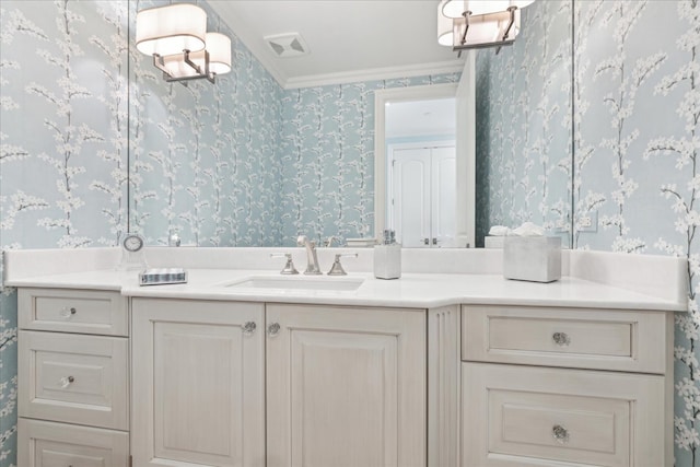 bathroom featuring vanity and crown molding